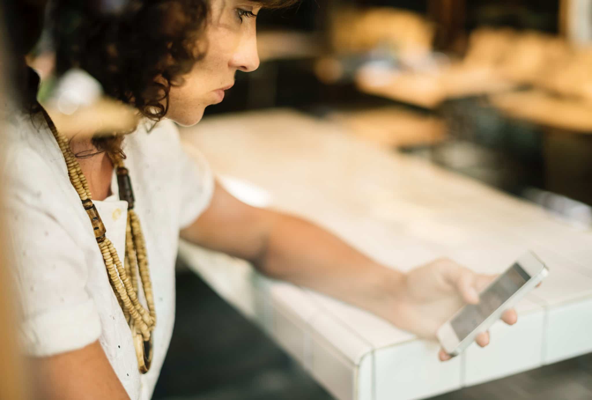 a woman visiting a ecommerce on her phone